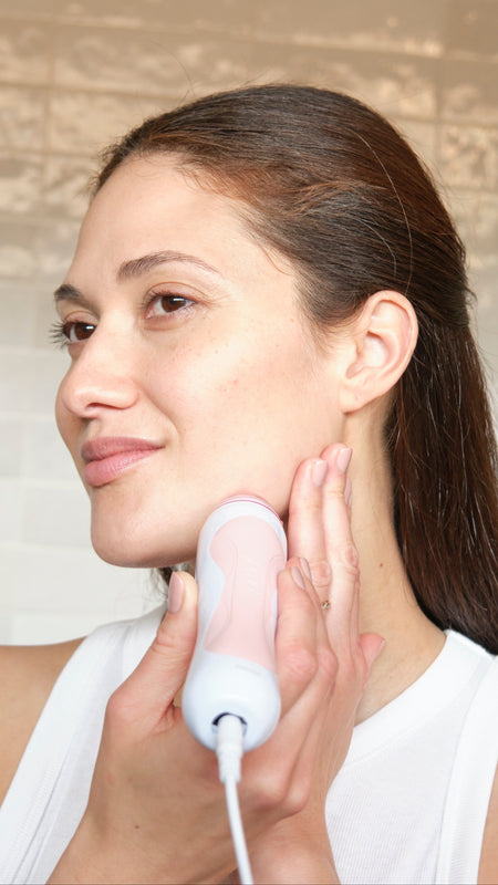 Skin-First Innovation Image of a Woman Using Personal Microderm